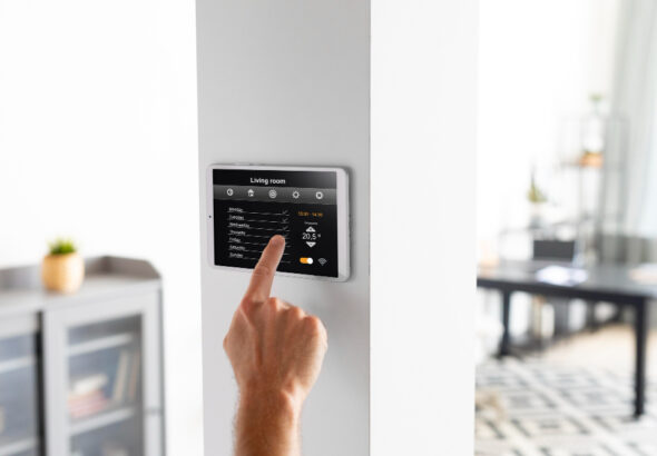 Best smart thermostats 2026 - five WiFi smart thermostats on a wall with energy savings display and smartphone app control